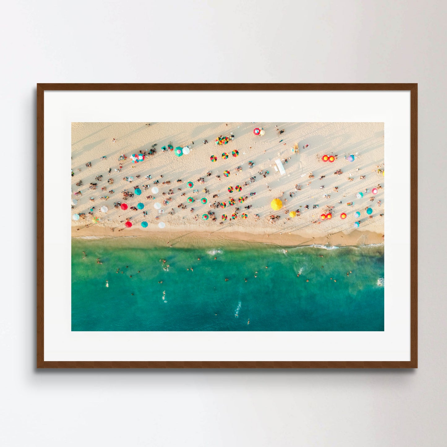 Aerial view of a crowded beach, umbrellas and people on the sand