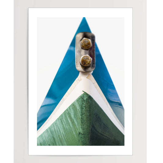 Blue and green hull of sail boat