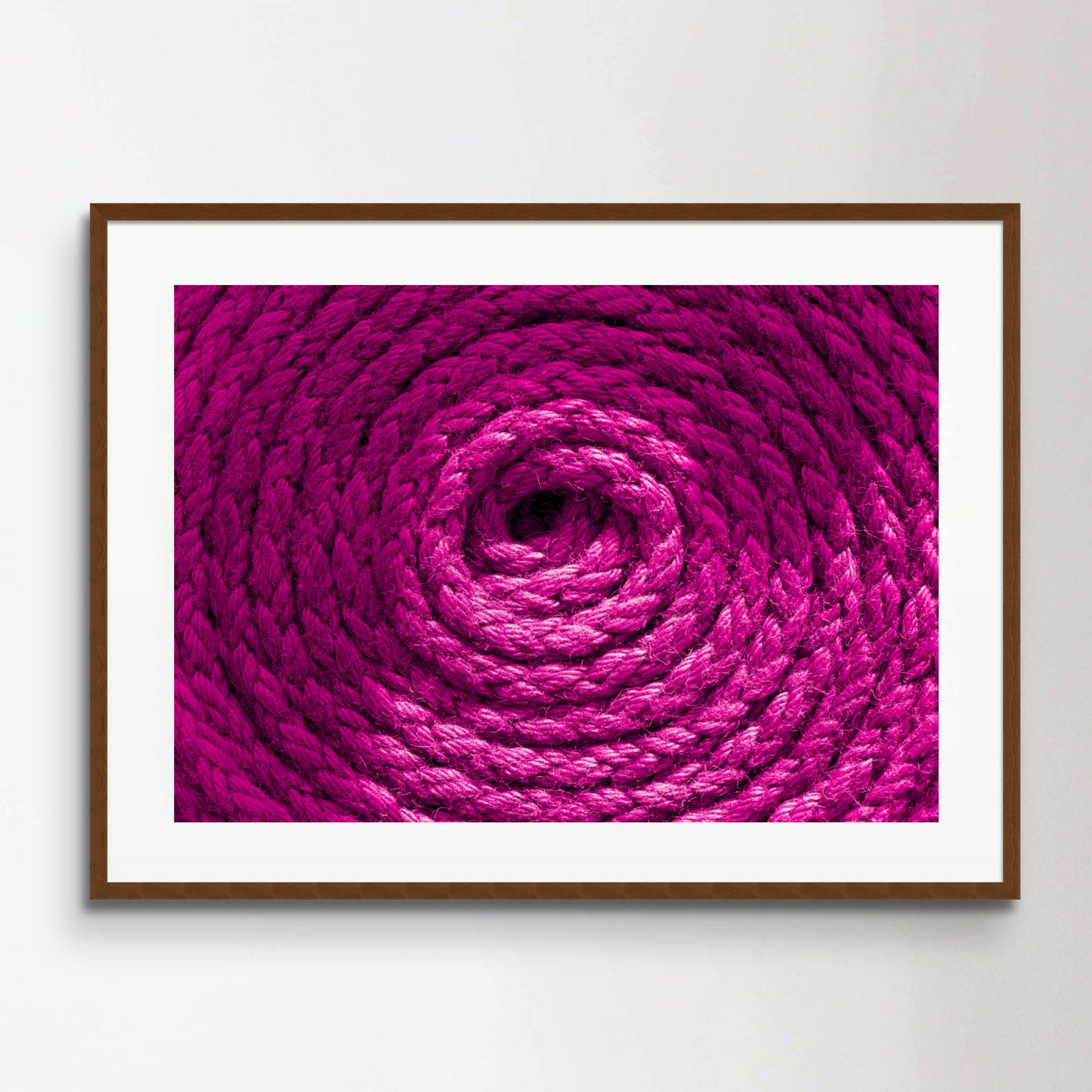 Heavy-duty magenta pink coiled ships rope