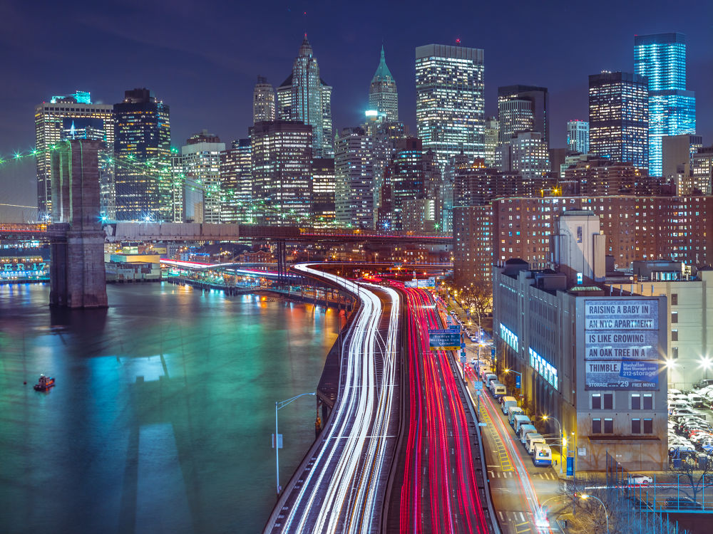 Strip lights on streets of Manhattan by east river, New York