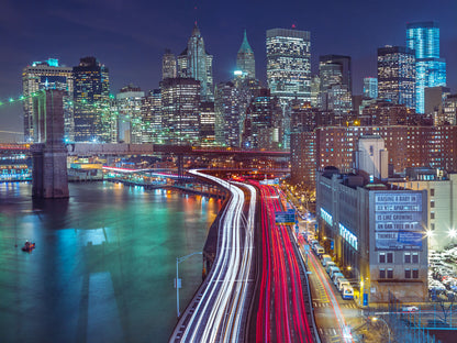 Strip lights on streets of Manhattan by east river, New York